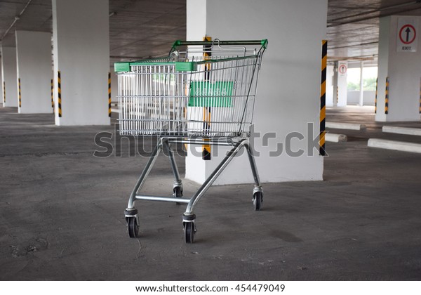empty shopping cart in\
empty car park