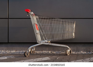 Empty Shopping Cart At Mall Parking Lot.