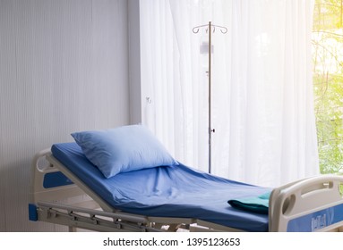 Empty Sickbed At Hospital Room For Supporting Patients