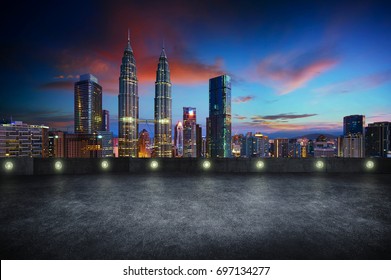 Empty Side View Asphalt Car Park With Kuala Lumpur City Skyline , Night Scene .