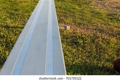 Empty Sideline Bench On The Football Field.