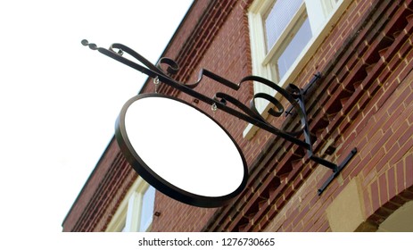 empty sign poster on brick wall, Blank round signboard, Road store advice render publicity old fashion curl forged shield plaque label bulletin for ad note text name design - Shutterstock ID 1276730665