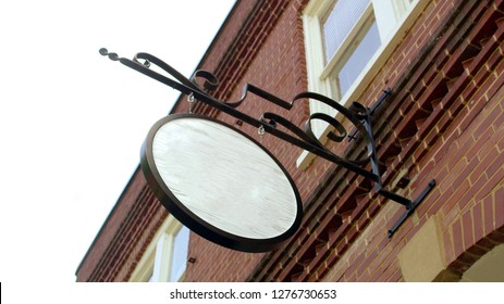 empty sign poster on a red brick wall, Road store advice render publicity old-fashioned curl forged shield plaque label bulletin for ad note text name design. - Shutterstock ID 1276730653