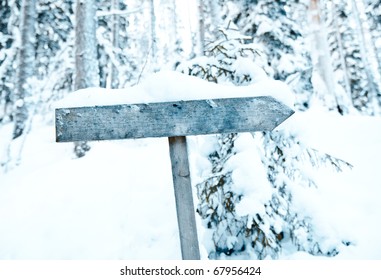 an empty sign in a winter setting. (Put in your own text)