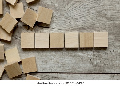 Empty Six White Cubes On A Wooden Background. A Lot Of Wood Blocks