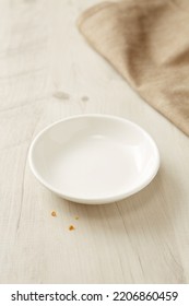 Empty Small White Plate On Wooden Table