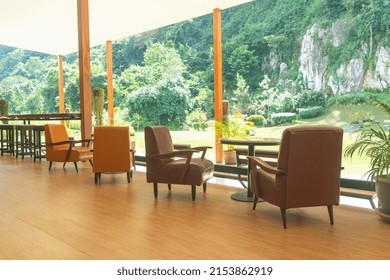 Empty Sofa Chair With Table On Balcony With Mountain Hill Background