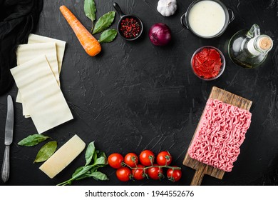 Empty space clean Frame set The concept of cooking lasagna. Italian Ingredients, meat herbs tomatoes, bechamel sauce, on black stone background, top view, flat lay, with copy space for text - Shutterstock ID 1944552676