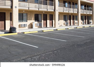 Empty Space In A Parking Lot Infront Of Motel Room