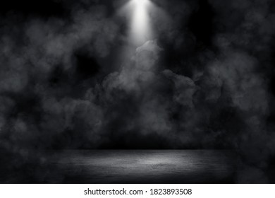 Empty space of Studio dark room concrete floor grunge texture background with spot lighting and fog or mist in background.