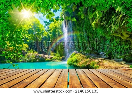 Empty space table background for decoration and waterfall view. Sunlight and beautiful flow view. background theme for nature scenery. Spring colors in stunning waterfall scenery. Antalya, Turkey.