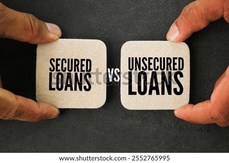 empty space with the words Secured vs Unsecured Loans. Business concept