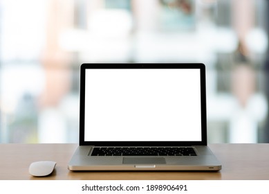 Empty space,Wooden table with Laptop with blank screen,blurred background of bokeh. - Image