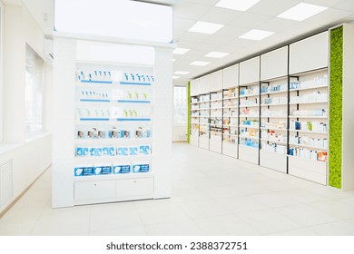 Empty spacious modern new white drugstore pharmacy chemist`s store with shelves full of medicines, pills, vitamins, painkillers, antibiotics without visitors - Powered by Shutterstock