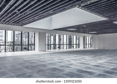 Empty spacious room with big windows