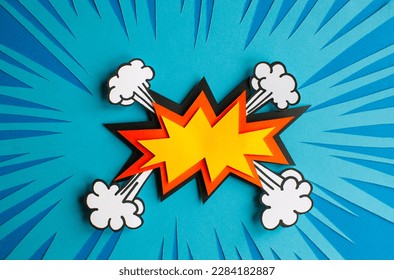 Empty speech bubble for your design. Handmade cut out paper craft art work on blue background. Pop art and comic style. 