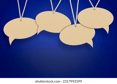 empty speech bubbles hanging on a thread on a blue background