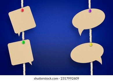 empty speech bubbles hanging on a thread on a blue background