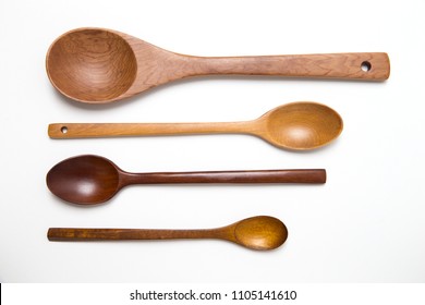 empty Spoons of different sizes with copy space. four wooden spoons on white background for text.
 - Shutterstock ID 1105141610