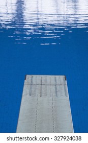 Empty Spring Board In An Empty Swimming Pool