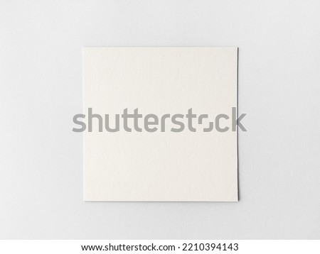 empty square cardboard sheet on a grey background. empty space for text