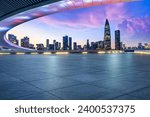 Empty square floor and bridge buildings with city skyline at dusk in Shenzhen, Guangdong Province, China.