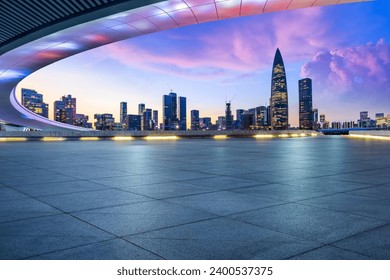 Empty square floor and bridge buildings with city skyline at dusk in Shenzhen, Guangdong Province, China. - Powered by Shutterstock