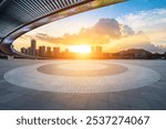 Empty square floor and bridge with modern city buildings scenery at sunset. car background .