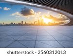 Empty square floor and bridge with modern city buildings scenery at sunrise in Shenzhen, China. Outdoor city background.