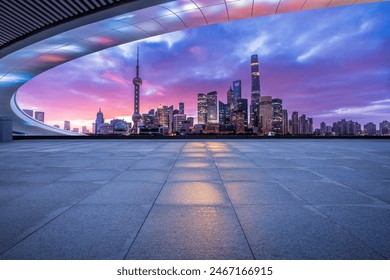 Empty square floor and bridge with modern city buildings scenery at night in Shanghai