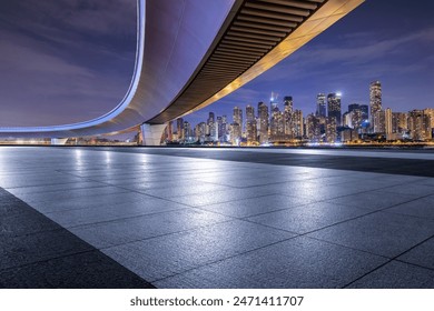 Empty square floor and bridge with modern city buildings scenery at night in Chongqing - Powered by Shutterstock