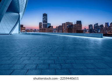 Empty square floor and city skyline with modern building at sunrise in Shanghai, China. - Powered by Shutterstock