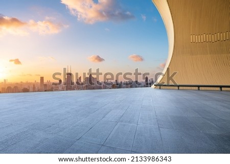 Empty square floor and city skyline with buildings in Shanghai at sunset, China.