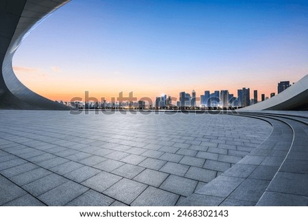 Similar – Image, Stock Photo Dusk in the city with chairs and table in front of a pub