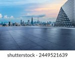 Empty square floor and glass wall with city skyline at dusk in Shenzhen. City square and modern buildings background.