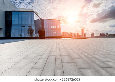 Empty square floor and glass wall with modern city skyline in Ningbo, Zhejiang Province, China.   