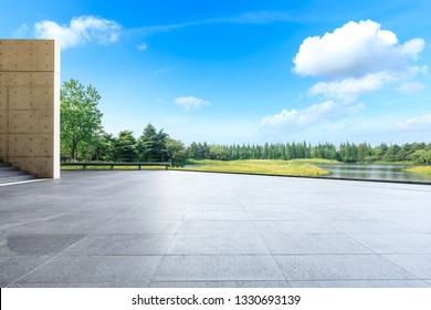 Empty Square Floor And Green Forest In The City Park