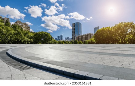 Empty square floor and green forest with city skyline scenery