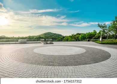 Empty square floor and green mountain landscape at sunset. - Powered by Shutterstock