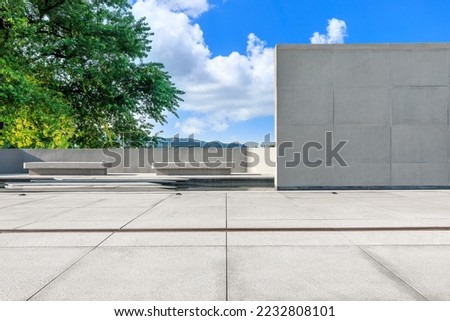 Empty square floor and green tree background