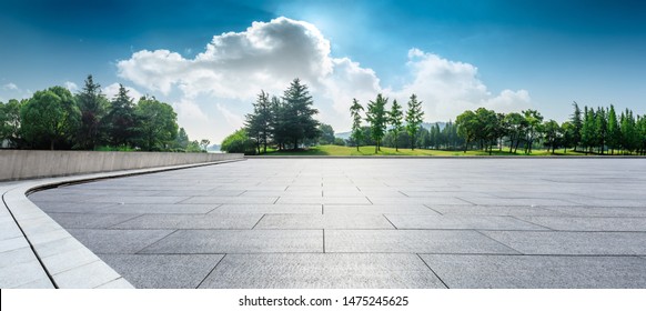 Empty Square Floor And Green Woods Natural Scenery In City Park