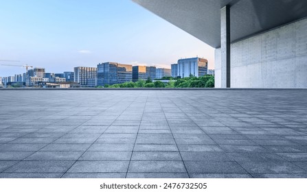 Empty square floor and modern city buildings scenery at sunset - Powered by Shutterstock