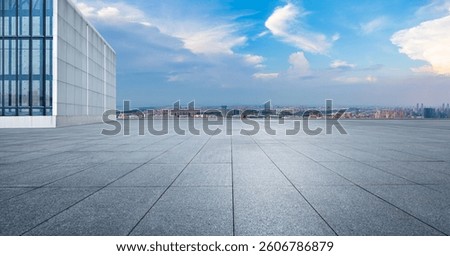 Empty square floor on a rooftop overlooking the cityscape 