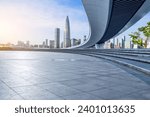 Empty square floor and pedestrian bridge with city skyline in Shenzhen, Guangdong Province, China. 