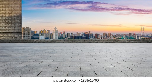 Empty square floor and Shanghai skyline with buildings at dusk,China.High angle view. - Powered by Shutterstock