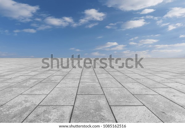 Empty\
square floor tiles and beautiful sky\
landscape\
