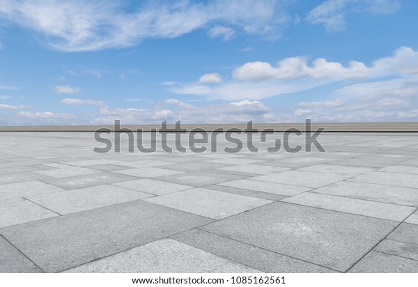 Empty
square floor tiles and beautiful sky
landscape
