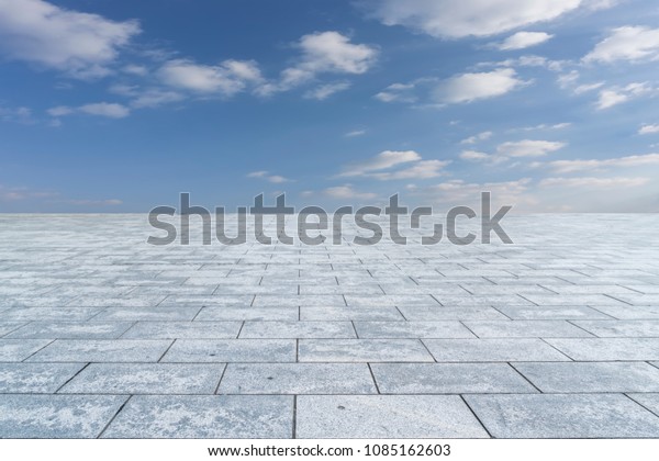 Empty\
square floor tiles and beautiful sky\
landscape\
