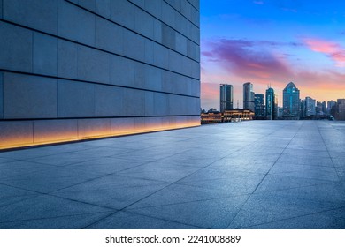Empty square floor and wall building with city skyline in Shanghai at night, China. - Shutterstock ID 2241008889