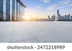 Empty square floors and city skyline with modern buildings in Chongqing at sunrise